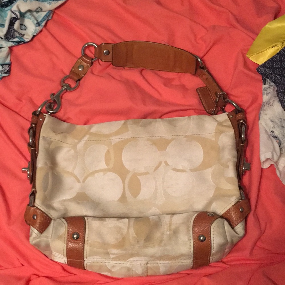 Tan colored coach purse